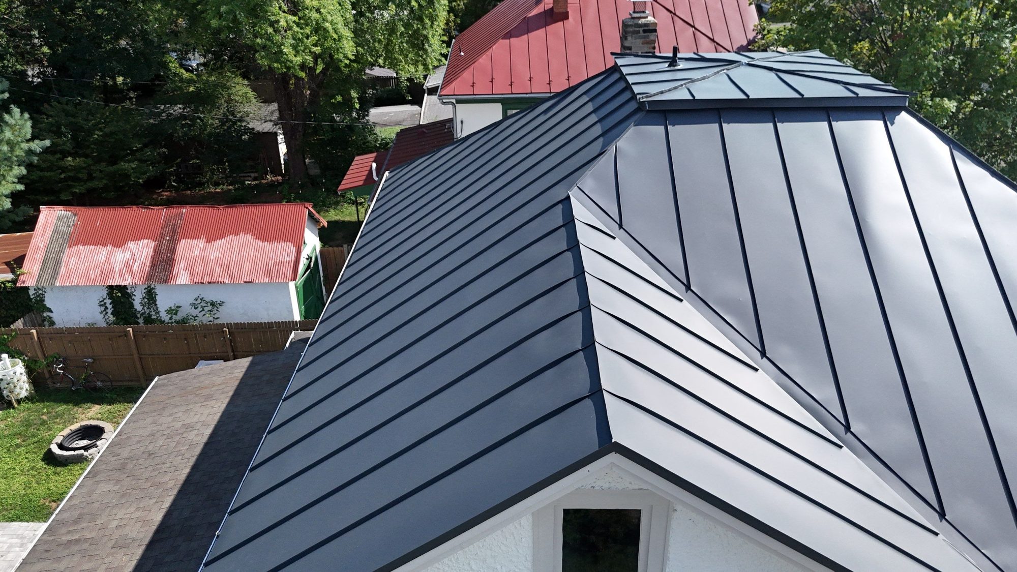 Charcoal standing-seam roof from the air