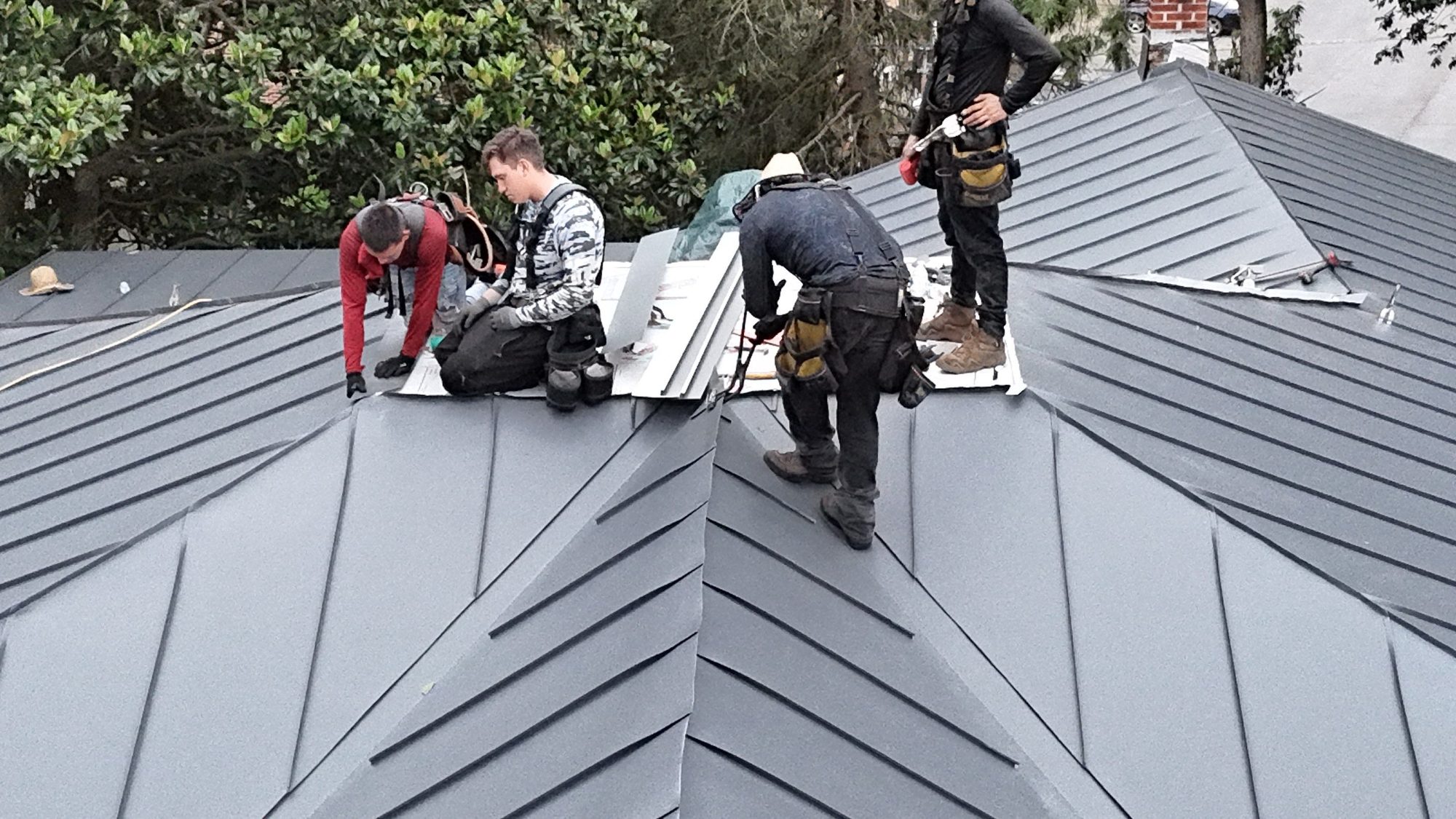 ORA crew installing standing-seam panels