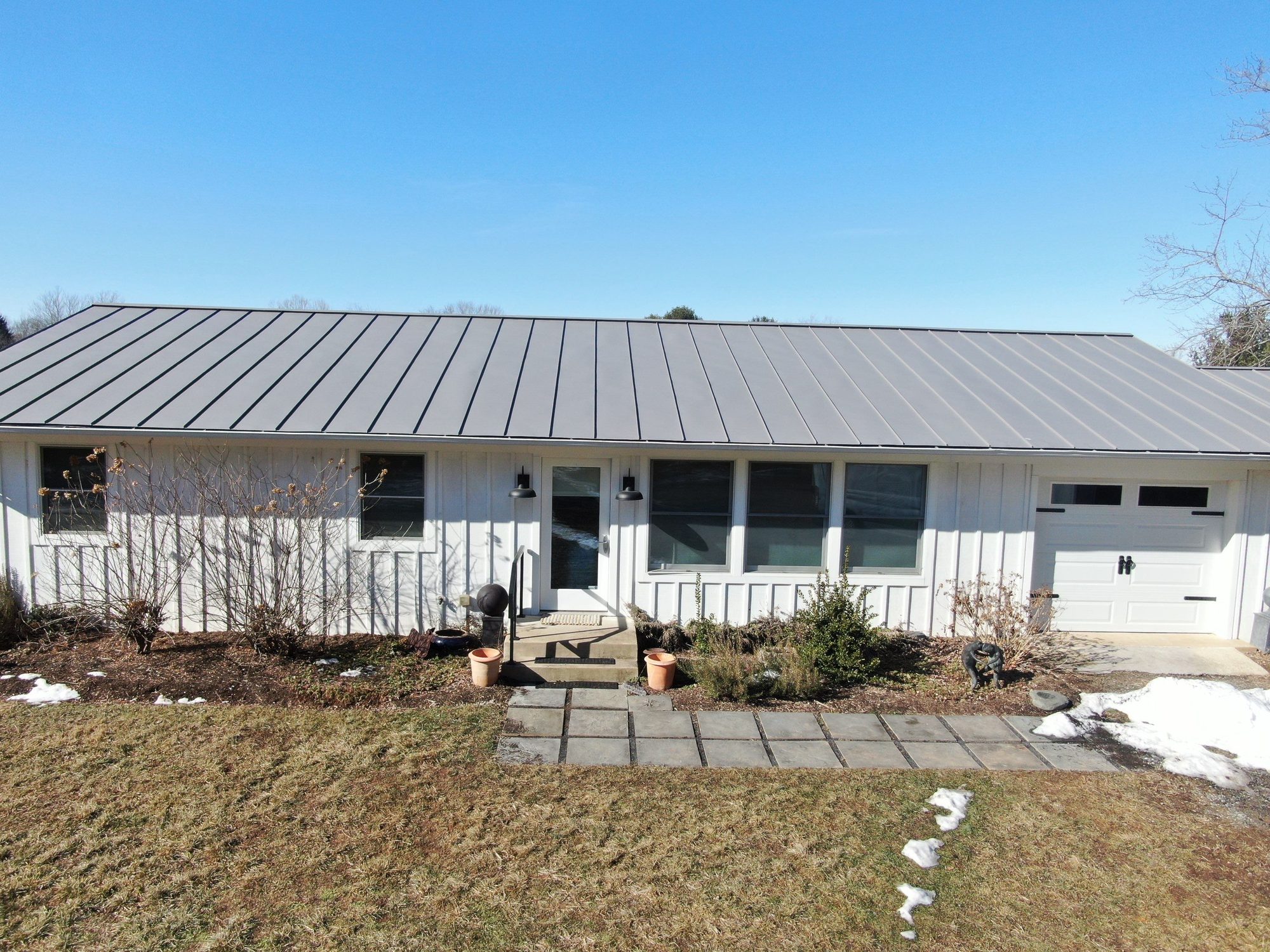 Finished standing-seam roof on a ranch home