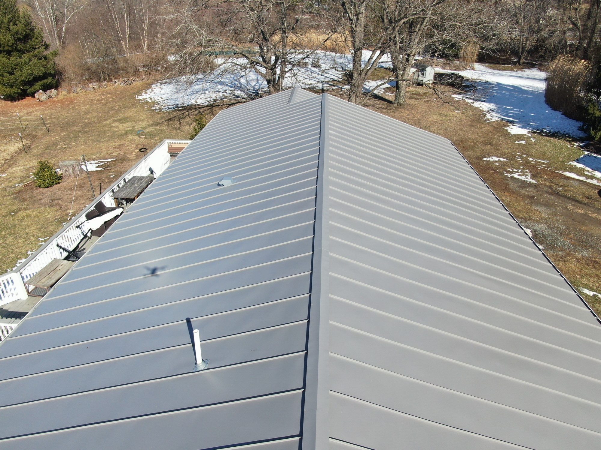 Ridge line of a gray standing-seam roof